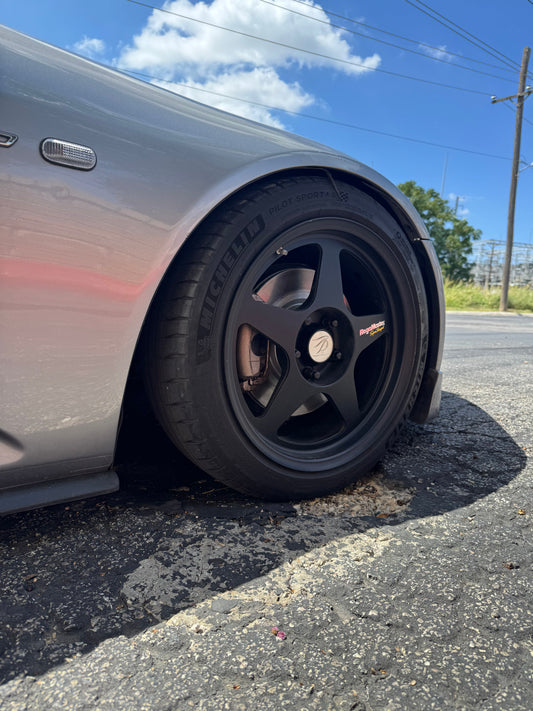 S2000 wheel sitting in a pothole
