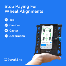 A hand holding a smartphone with the Gyraline app on the screen, displaying a wheel alignment interface, alongside a toolkit.